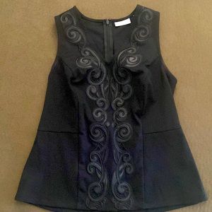 Stretch Sleeveless Shell
Zipper in back
Faux leather details
Size small 
Black